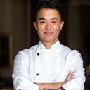 Professional headshot of Chef Kaito Tanaka in his chef's whites.